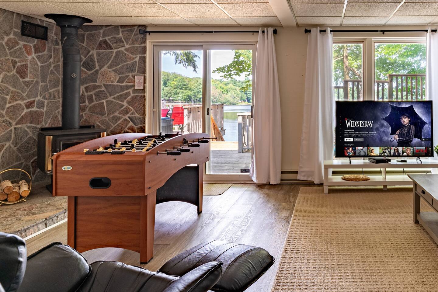 Tranquil morning dock scene with Muskoka chairs and misty lake