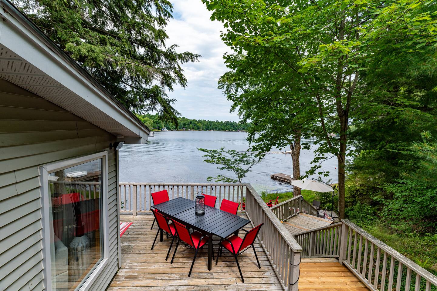 Main deck with wicker seating and red outdoor dining area
