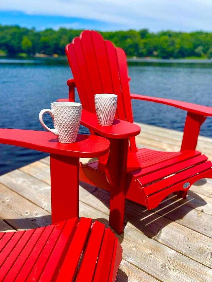 Bedroom with botanical artwork and mirrored closet doors